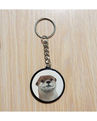 Porte‑clé artisanal créé à partir d’une illustration originale.