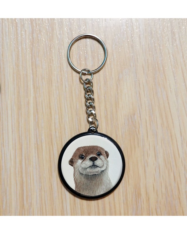 Porte‑clé artisanal créé à partir d’une illustration originale.