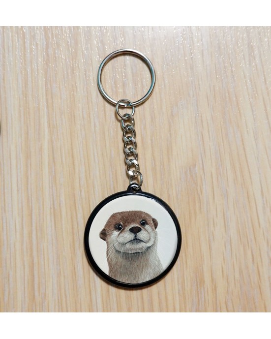 Porte‑clé artisanal créé à partir d’une illustration originale.